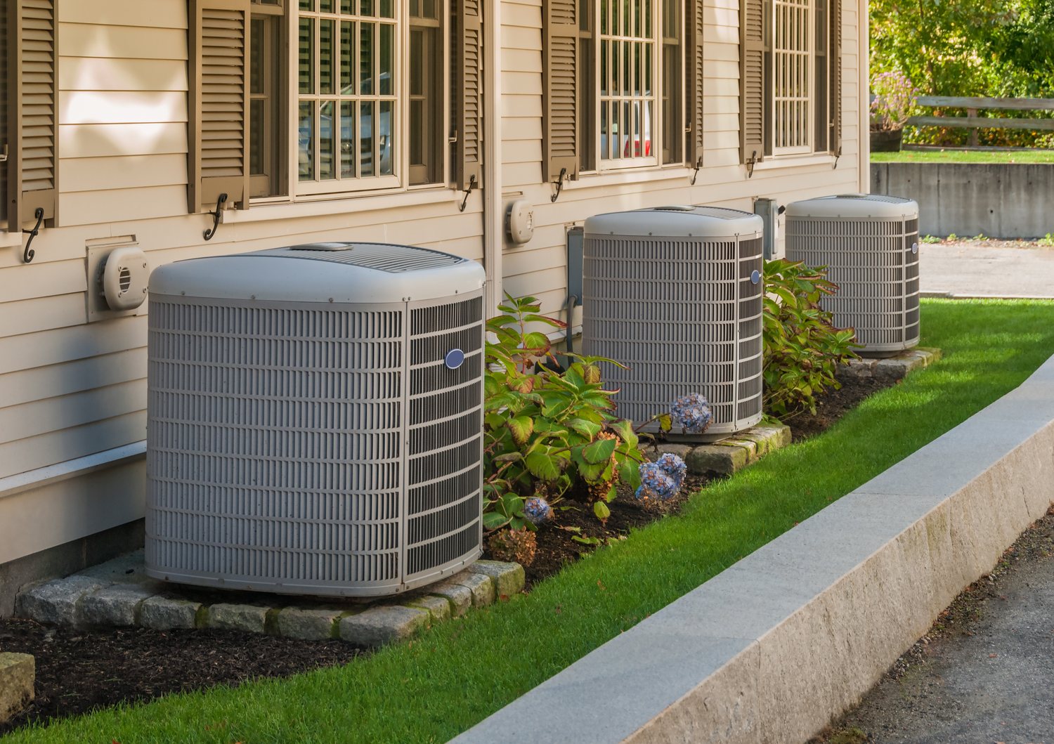 Air conditioning units beside a home in the Austin area